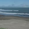 Peru, Trujillo, Puerto Chicama beach, wet sand