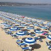 Italy, Calabria, Vibo Marina beach, parasols