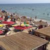 Italy, Campania, Lido Lago beach, tiki huts