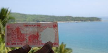 India, Andaman Isl, Port Blair, North Bay beach, banknote