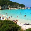 Greece, Antipaxos, Voutoumi beach, big boat