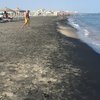 Italy, Apulia, Margherita di Savoia beach, black sand