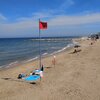Italy, Abruzzo, Casalbordino beach, red flag