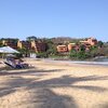Mexico, Zihuatanejo bay, Playa Quieta beach, palm shade