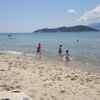 Greece, Keramoti beach, islet on the horizon