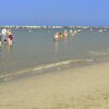 Italy, Emilia-Romagna, Gatteo A Mare beach, wet sand