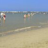 Italy, Emilia-Romagna, Gatteo A Mare beach, wet sand