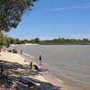 Uruguay, Playa La Arenisca beach, fishermen