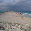 Spain, Platja de Llevant beach, Ibiza on the horizon