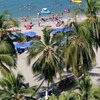 Colombia, Santa Marta, Playa El Rodadero beach, palms