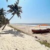 India, Kerala, Chellanam beach, palm & boat
