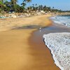 India, Kerala, Eravipuram beach, wet sand